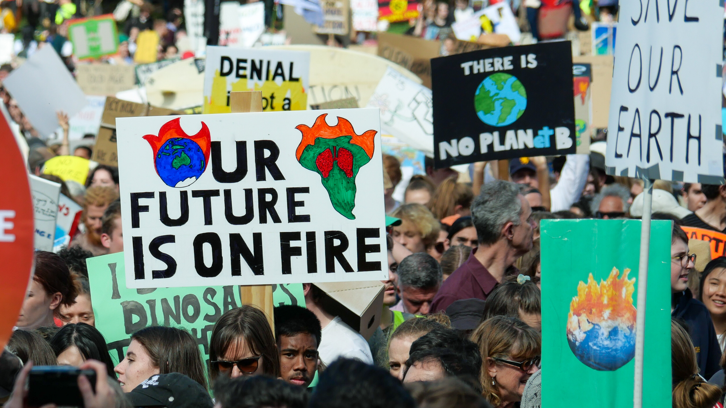 A photo of a sign that reads 'our future is on fire' at a School Strike for Climate protest in Sydney.